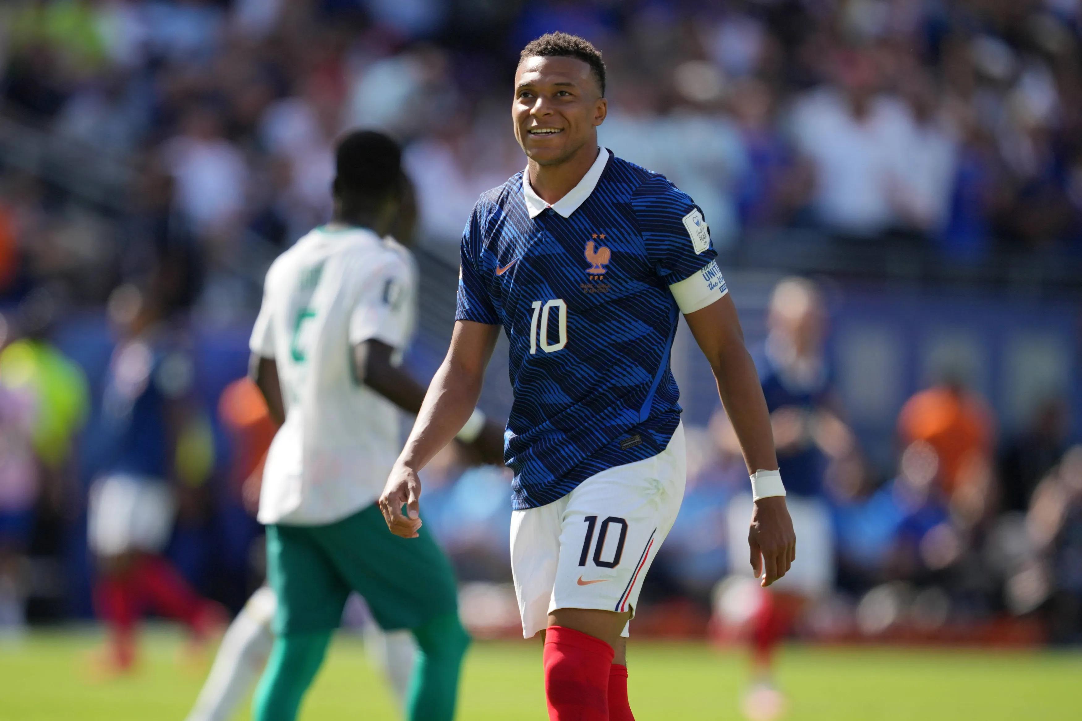 The two captains — Deschamps watches from the stands as Mbappe matches his century in Philadelphia